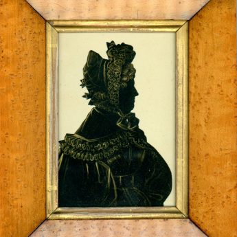 Cut and gilded silhouette of a mature lady; gallery trade label no. 5