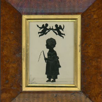 Cut and lightly bronzed silhouette of a child holding a toy whip