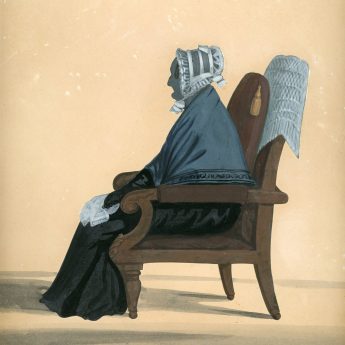 Cut silhouette of an elderly lady seated in an armchair
