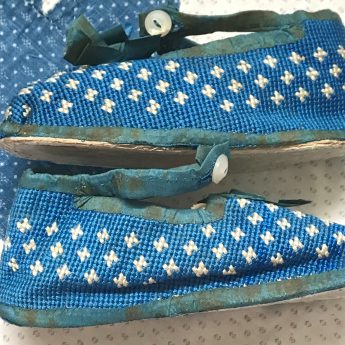 A delightful pair of blue shoes for a child