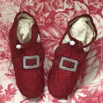 A pair of ruby red children's shoes, circa 1800