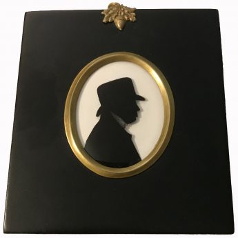 Silhouette of a gentleman in a soft-crowned hat