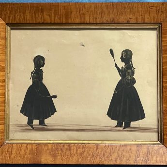 Cut and gilded silhouette of girls playing battledore
