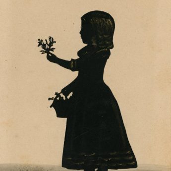 Cut and lightly bronzed silhouette of a child with flowers