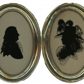 A fine pair of silhouettes reverse painted on glass by Walter Jorden