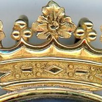 Intricate crest on the frame of a miniature portrait of an aristocratic child