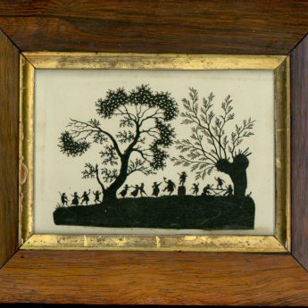 Cut paper picture of folk dancing out in the woods