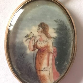 Miniature pendant painting of a lady with a tethered bird