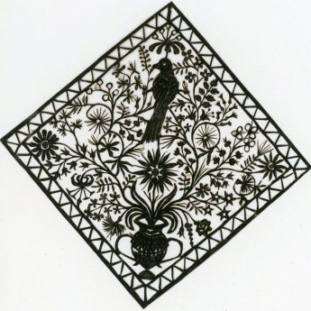 Cut paper picture featuring flowers and a bird.