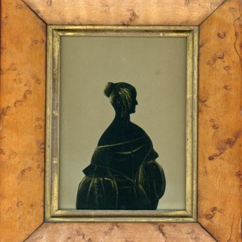 Cut and gilded silhouette of a lady by the Hubard Gallery