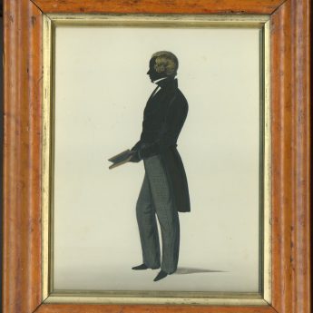 Painted and gilded full-length silhouette of a gentleman in checked trousers