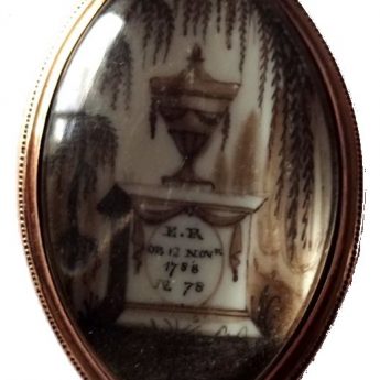 Family group of miniatures including a memorial brooch