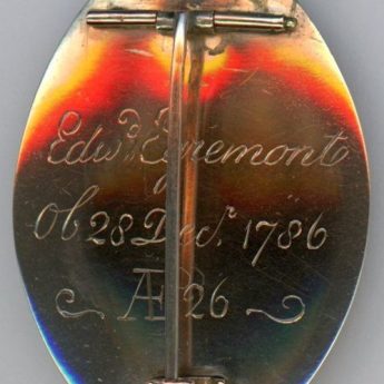 Gold and enamel memorial brooch dated 1786 with a sepia and chopped hair painting