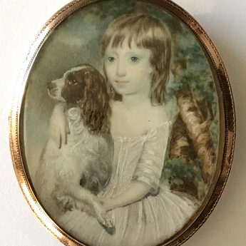 Miniature portrait of a child with his pet spaniel