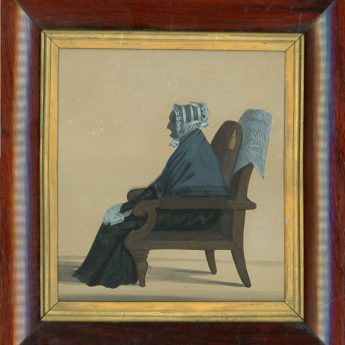 Cut silhouette of an elderly lady seated in an armchair
