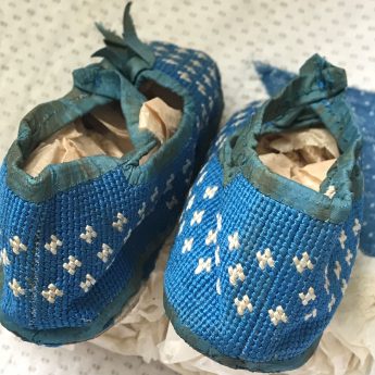 A delightful pair of blue shoes for a child