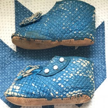 Old pair of children's boots with glass buttons