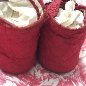 A pair of ruby red children's shoes, circa 1800