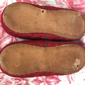 A pair of ruby red children's shoes, circa 1800