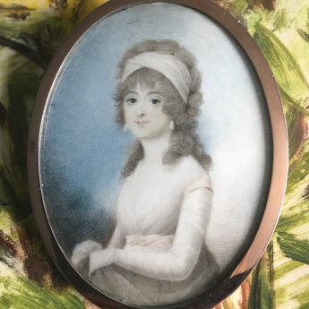 Miniature portrait of a young lady wearing pearl drop earrings