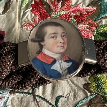 Miniature portrait of a gentleman set in a bracelet with a woven hair band