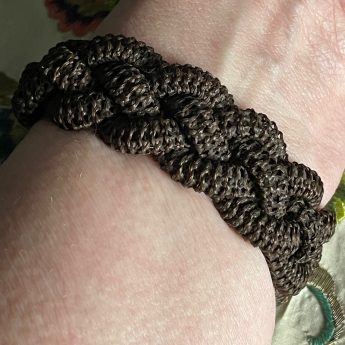 Miniature portrait of a gentleman set in a bracelet with a woven hair band