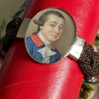 Miniature portrait of a gentleman set in a bracelet with a woven hair band
