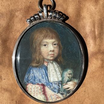 Miniature portrait of a child with a blue parrot