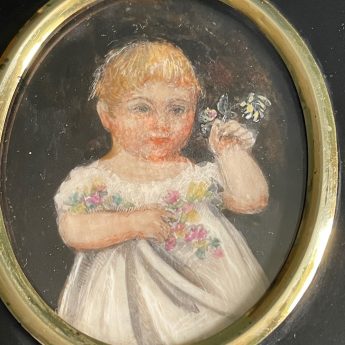 Miniature portrait of a child holding flowers