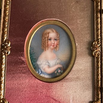 Miniature portrait of a child in a carved case