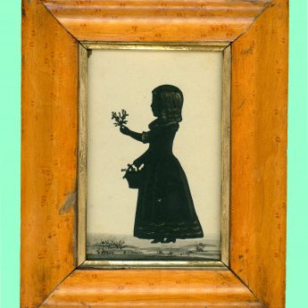 Cut and lightly bronzed silhouette of a child with flowers