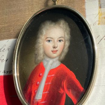 Oil on copper portrait of a boy in a red coat