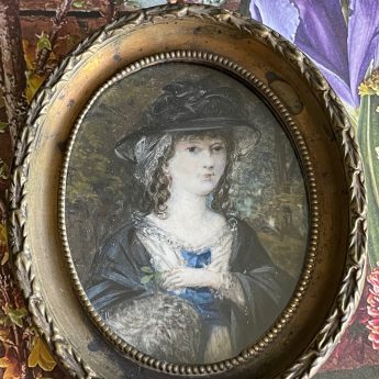 Miniature portrait of a fashionable young lady in a garden landscape