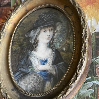 Miniature portrait of a fashionable young lady in a garden landscape
