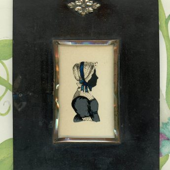 Silhouette of a lady reverse painted on flat glass using colour