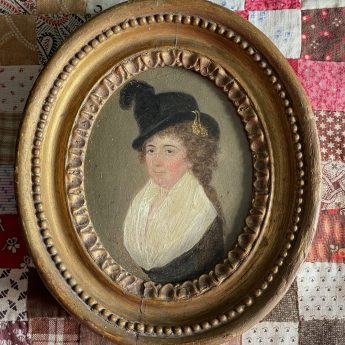 Small oil on metal portrait of a lady wearing a riding habit