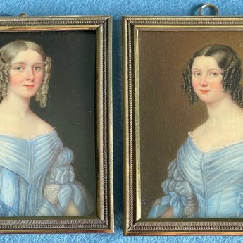 A pair of portrait miniatures of sisters in blue dresses