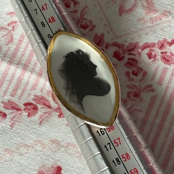 John Miers, gold silhouette ring featuring a lady with a veiled headdress