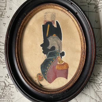 Painted silhouette of an officer partly in colour