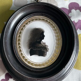 Isabella Beetham, silhouette reverse painted on glass of a child
