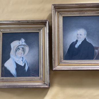 A pair of watrecolour portrait of a country squire and his wife