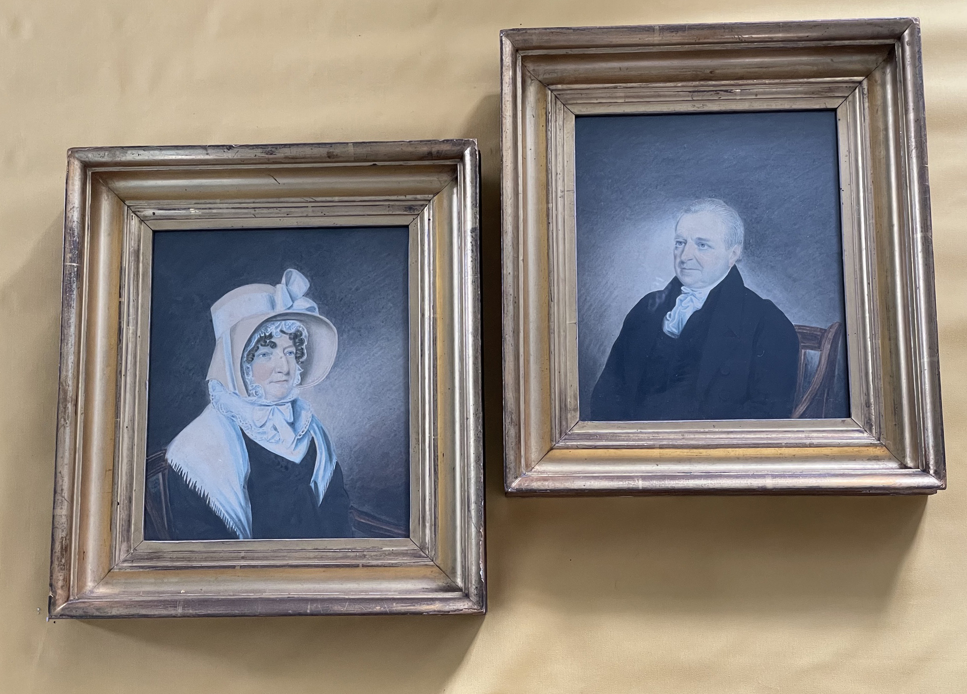 A pair of watrecolour portrait of a country squire and his wife