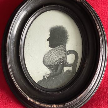 William Phelps, silhouette painted on plaster of a lady seated