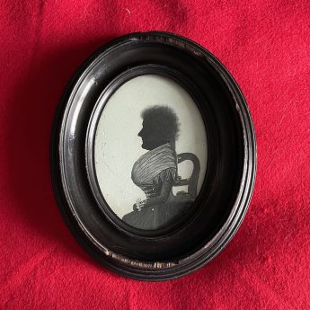 William Phelps, silhouette painted on plaster of a lady seated