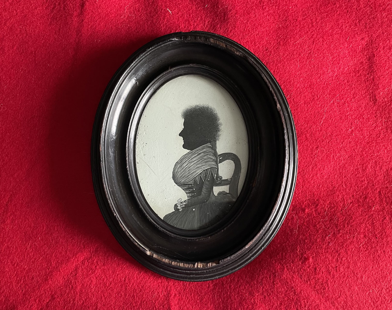 William Phelps, silhouette painted on plaster of a lady seated