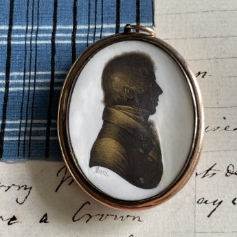 John Field, bronzed profile of a gentleman in a locket frame