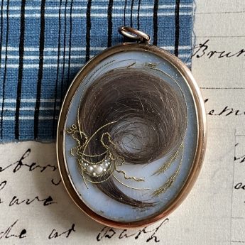 John Field, bronzed profile of a gentleman in a locket frame
